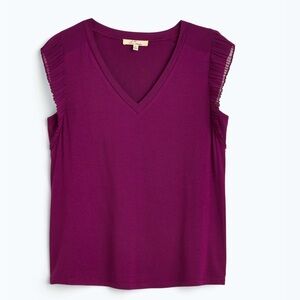 V neck.  Ruffle sleeve top.  Plum colored.